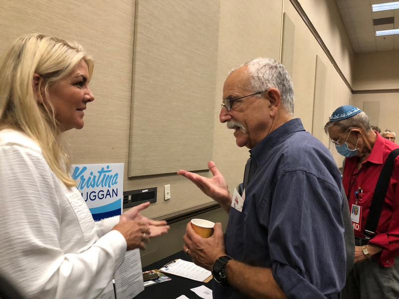Kristina discussing key issues with Jewish Long Beach voter. 